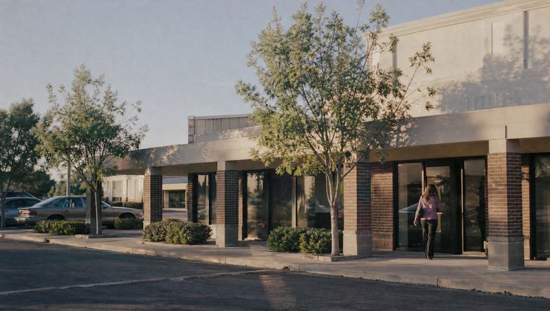A quiet street of small offices in the late afternoon